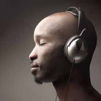 Man wearing headphones with a dark background