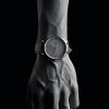 Hand wearing a watch