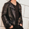 Man in leather jacket with black v-neck shirt
