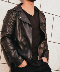 Man in leather jacket with black v-neck shirt