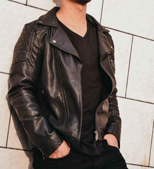 Man in leather jacket with black v-neck shirt